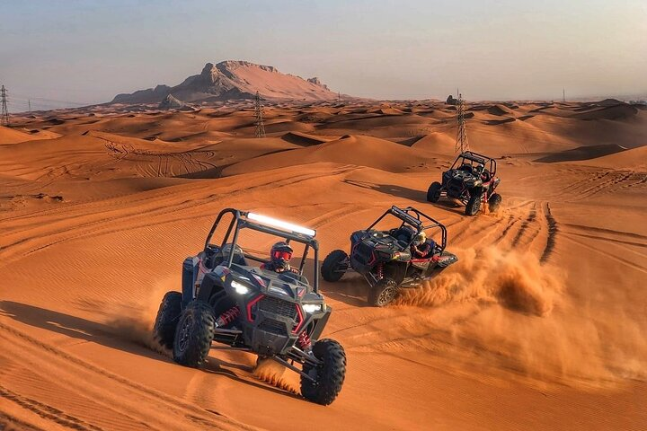 Experience the rush of self-driving through Dubai's stunning dunes navigating rugged terrain while enjoying the freedom and excitement of a private buggy adventure. Adventure awaits in every turn!